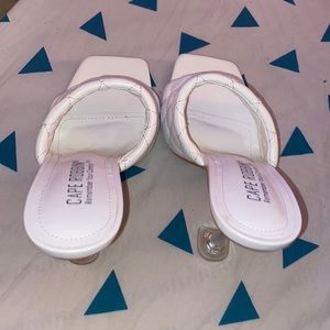 White size 7 heels . Never worn